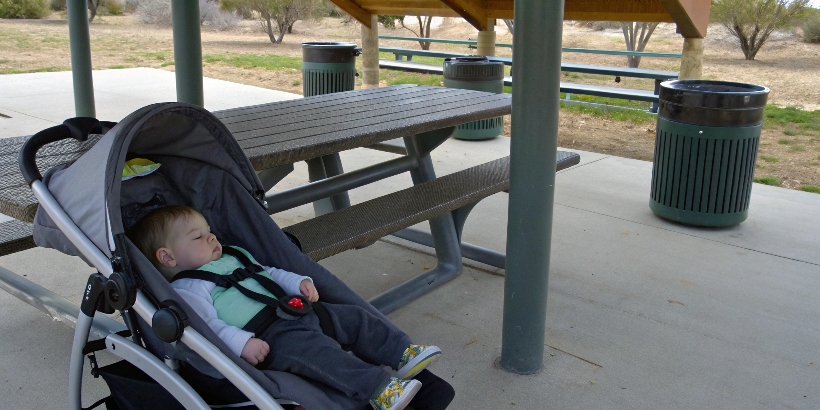 alt with keywords: Infant in stroller at rest stop
